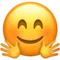 Smiling Face with Open Hands emoji on Apple iOS 16.4