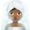 Kvinna i ångrum: Mellanmörk hudton emoji på iPhone (iOS 12.2)