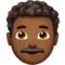 Man: Medium-Dark Skin Tone, Curly Hair emoji on Apple iOS 14.5