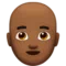 Mężczyzna: średniociemny odcień skóry, łysy emoji na Apple iOS 15.4