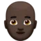 Man: Dark Skin Tone, Bald emoji on Apple iOS 12.1