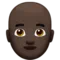 Man: Dark Skin Tone, Bald emoji on Apple iOS 17.4