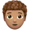 Person: Medium Skin Tone, Curly Hair emoji on Apple iOS 13.2