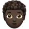 Person: Dark Skin Tone, Curly Hair emoji on iPhone