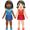 牵手的女性：中等至深色肤色，浅色肤色 iPhone 上的表情符号 (iOS 14.2)