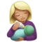 Woman Feeding Baby: Medium-Light Skin Tone emoji on iPhone