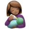 Woman Feeding Baby: Medium Skin Tone emoji on iPhone
