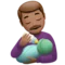 Man Feeding Baby: Medium Skin Tone emoji on iPhone