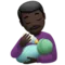 Man Feeding Baby: Dark Skin Tone emoji on iPhone