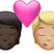 Kiss: Person, Person, Dark Skin Tone, Medium-Light Skin Tone emoji on iPhone