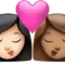 Kiss: Woman, Woman, Light Skin Tone, Medium Skin Tone emoji on iPhone