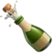 Flaske med poppekork emoji på iPhone
