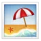 Strand med parasoll emoji på iPhone (iOS 9.1)